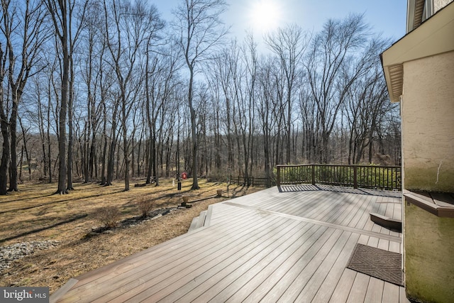 deck featuring a forest view