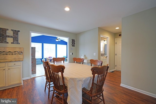 dining room with dark hardwood / wood-style floors