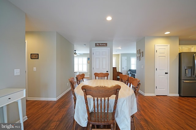 dining space with dark hardwood / wood-style floors