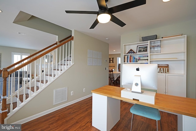 office space featuring dark wood-type flooring and ceiling fan