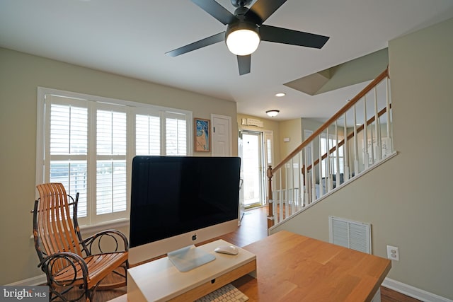 office space featuring ceiling fan and light wood-type flooring