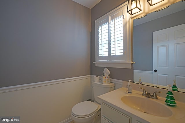 bathroom featuring vanity and toilet