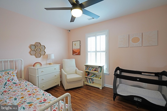 bedroom featuring dark hardwood / wood-style flooring and ceiling fan