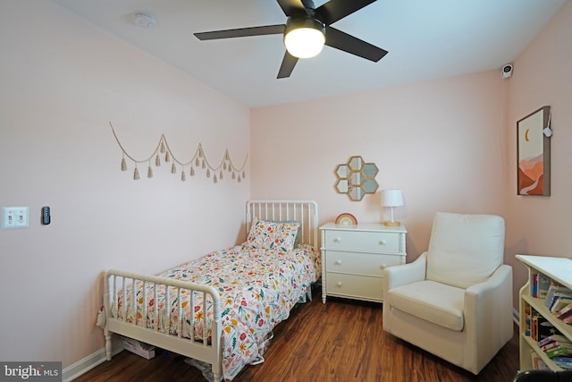 bedroom with dark wood-type flooring and ceiling fan