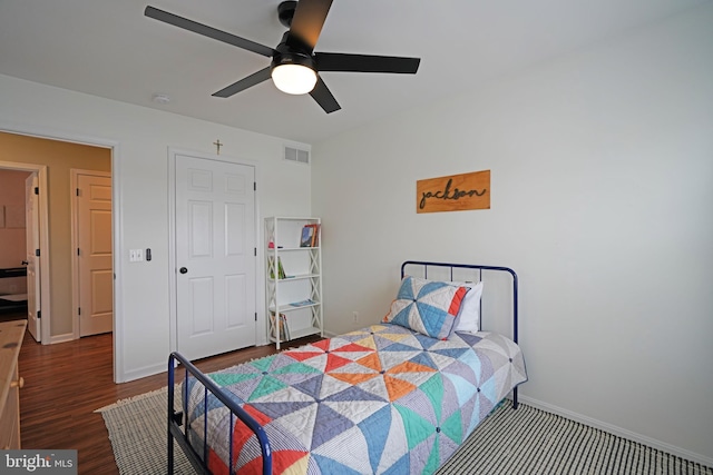 bedroom with hardwood / wood-style floors and ceiling fan