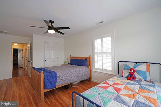 bedroom featuring wood-type flooring and ceiling fan