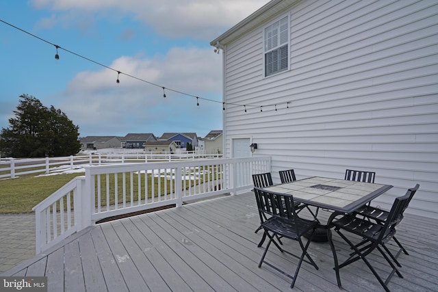 wooden deck with a yard