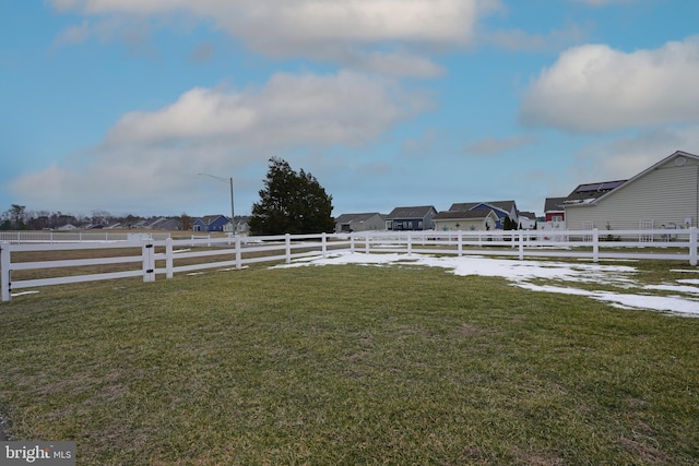 view of yard with a rural view