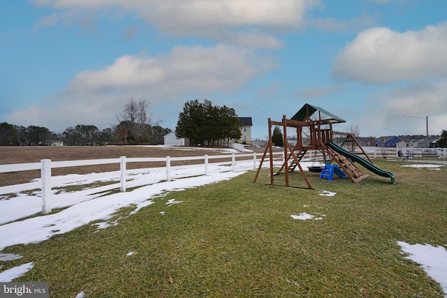 view of jungle gym featuring a lawn