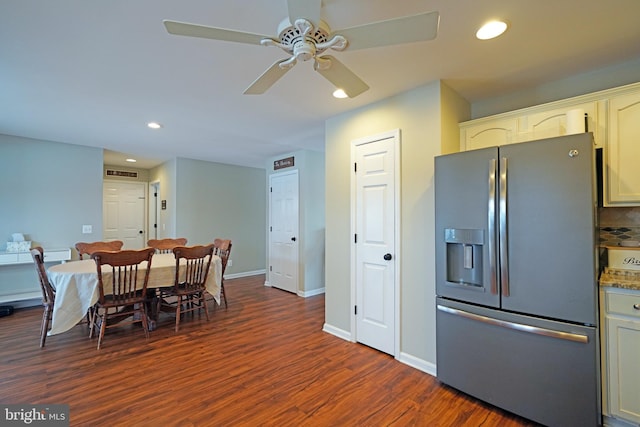 kitchen with ceiling fan, dark wood-type flooring, white cabinets, and stainless steel refrigerator with ice dispenser