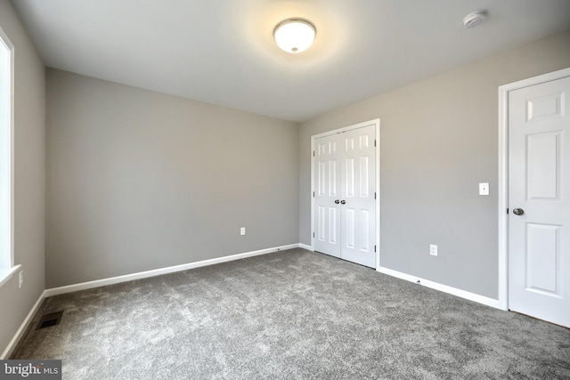 unfurnished bedroom featuring carpet floors