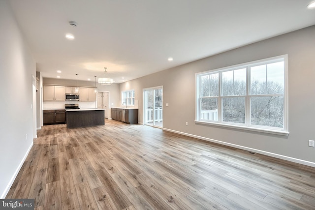 unfurnished living room featuring hardwood / wood-style floors