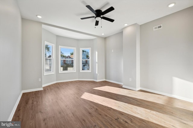 empty room featuring light wood-type flooring and ceiling fan