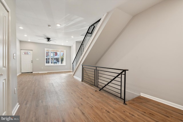 interior space with ceiling fan and light wood-type flooring