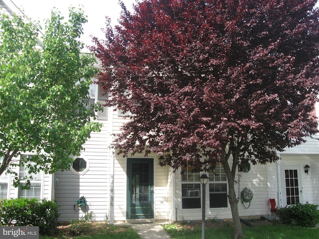 view of property hidden behind natural elements