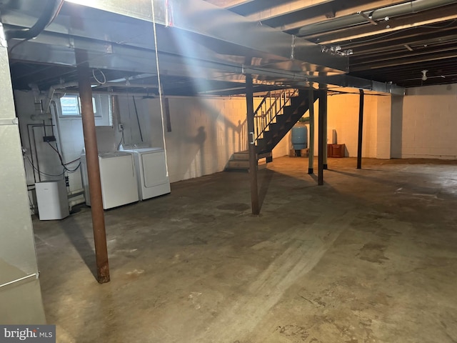 basement with washing machine and clothes dryer