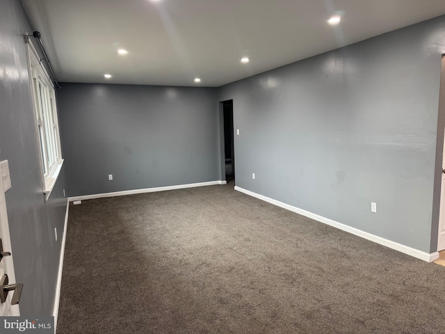 empty room featuring carpet flooring