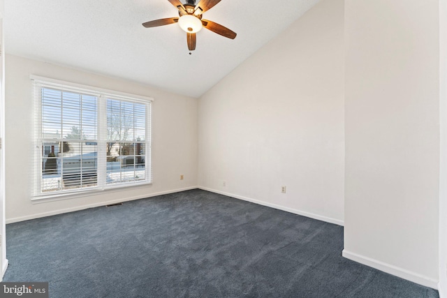 carpeted empty room with lofted ceiling and ceiling fan