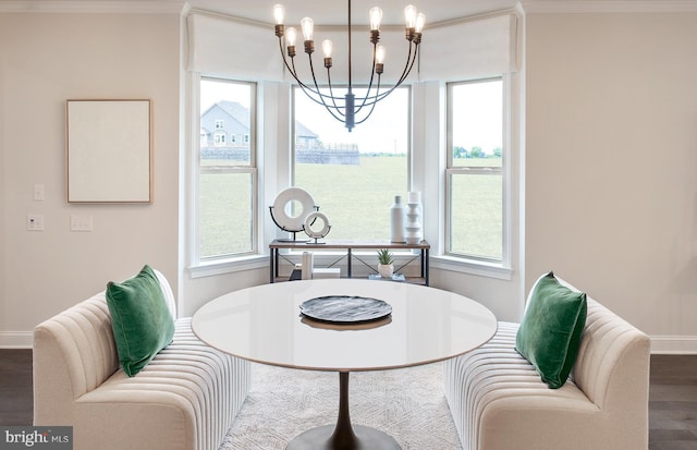 dining room with dark hardwood / wood-style flooring and a chandelier