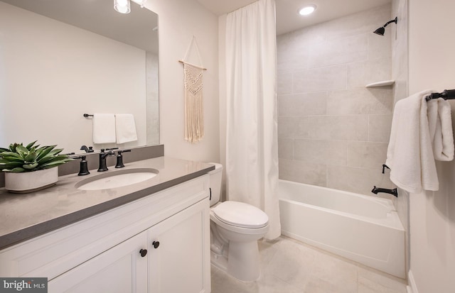 full bathroom with tile patterned floors, shower / tub combo with curtain, vanity, and toilet