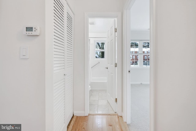 hall with light hardwood / wood-style floors