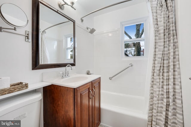 full bathroom with shower / tub combo, vanity, and toilet