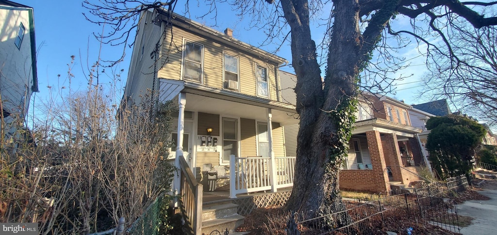 view of side of home featuring a porch