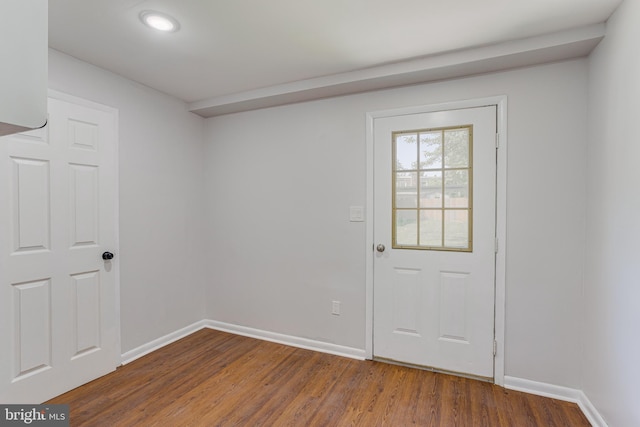 entryway with dark hardwood / wood-style floors