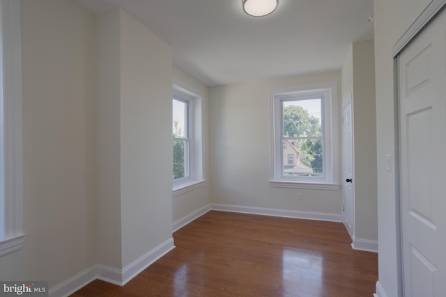 spare room featuring dark hardwood / wood-style floors