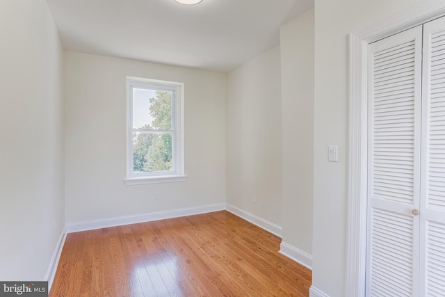 unfurnished room with light hardwood / wood-style floors