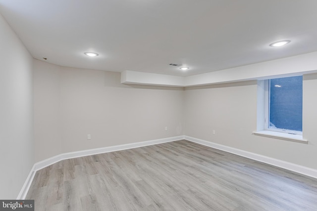 basement featuring light hardwood / wood-style flooring