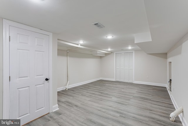 basement featuring light hardwood / wood-style floors