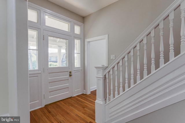 entryway with hardwood / wood-style floors