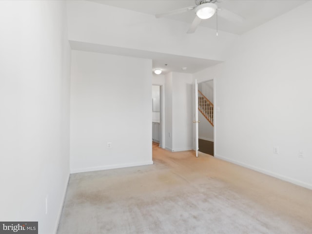 carpeted empty room with ceiling fan