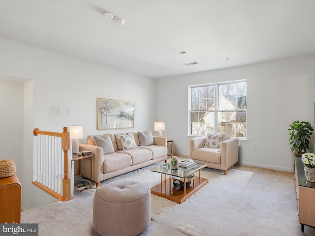 living room featuring light carpet