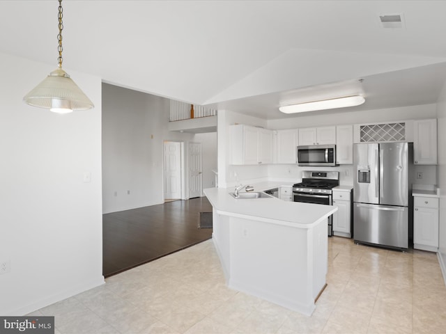 kitchen with white cabinetry, kitchen peninsula, and appliances with stainless steel finishes