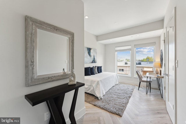 bedroom featuring light parquet flooring