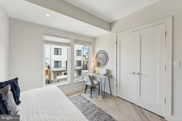 bedroom featuring light parquet flooring