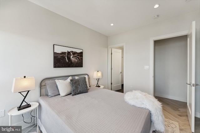 bedroom featuring light parquet floors