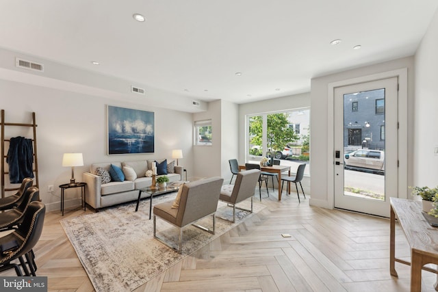 living room featuring light parquet flooring