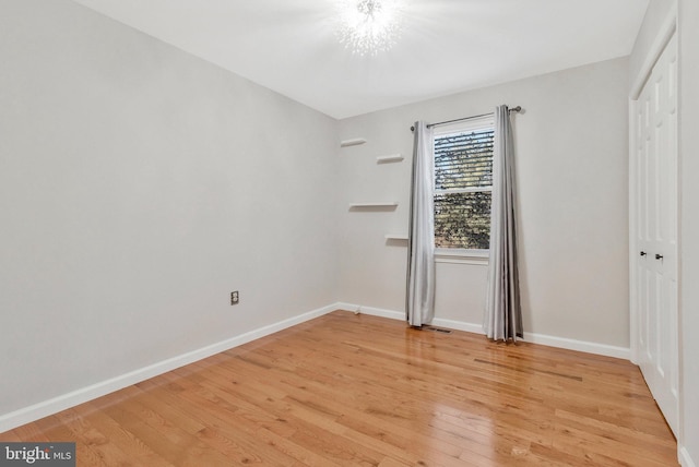 unfurnished bedroom featuring hardwood / wood-style flooring and a closet