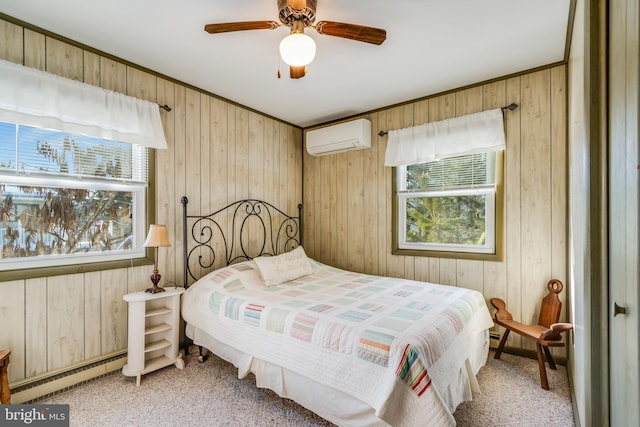 carpeted bedroom featuring a wall mounted air conditioner, wood walls, ceiling fan, and a baseboard heating unit