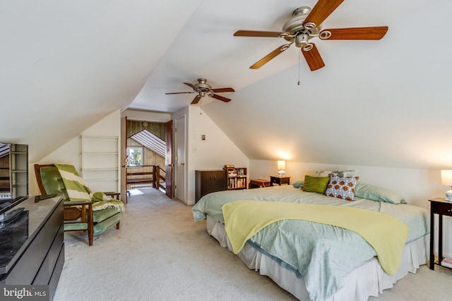 carpeted bedroom with vaulted ceiling and ceiling fan