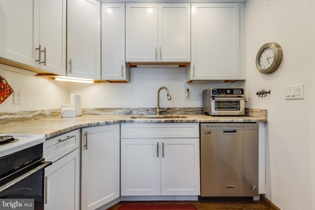 kitchen with dishwasher, sink, light stone countertops, and white cabinets