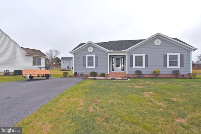 ranch-style house with a front lawn and central AC unit