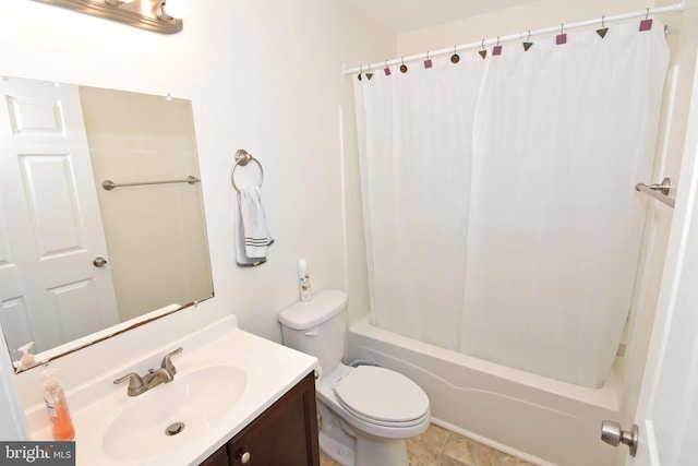 full bathroom featuring shower / bath combo, vanity, and toilet