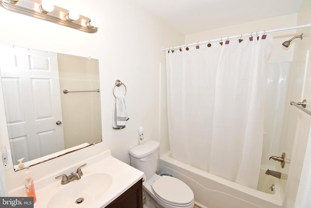 full bathroom with vanity, toilet, and shower / tub combo with curtain