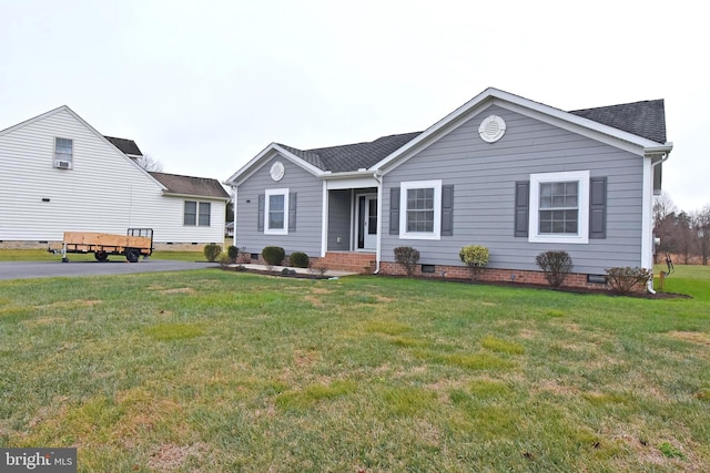 single story home featuring a front yard