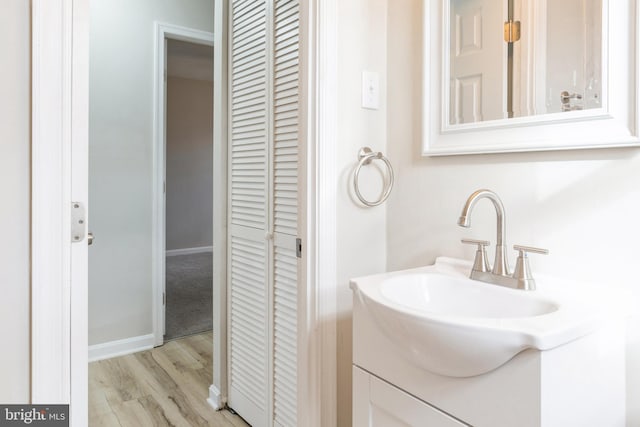 bathroom featuring hardwood / wood-style floors and vanity