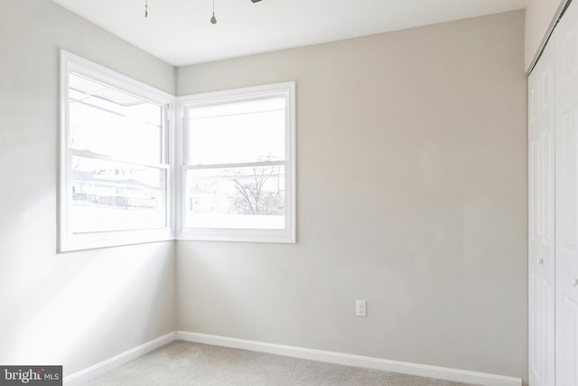 unfurnished bedroom with carpet and a closet